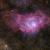 Gli eleganti drappeggi gassosi della Nebulosa Laguna M8, una immensa culla stellare nella costellazione del Sagittario.  